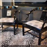 F30. Pair of Hollywood Regency style black lacquer chairs upholstered in Kelly Wearstler sunburst fabric. 